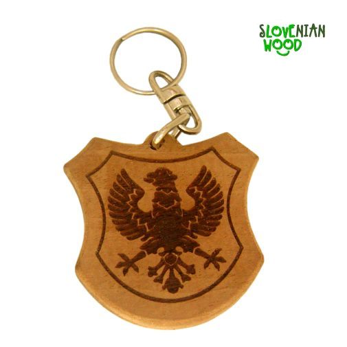 obesek po želji naročnika, ki se oblikovno prilega gravuri. Masivni les lokalnega izvora.
